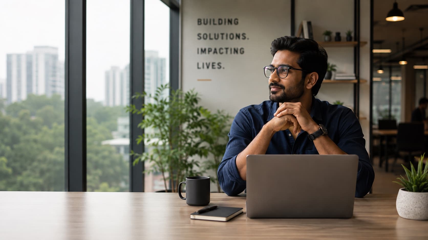An entrepreneur working in a modern Indian office
